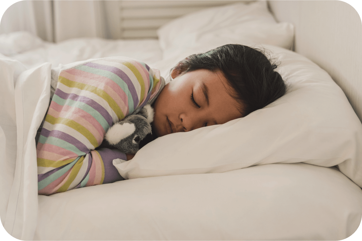 kid sleeping in bed